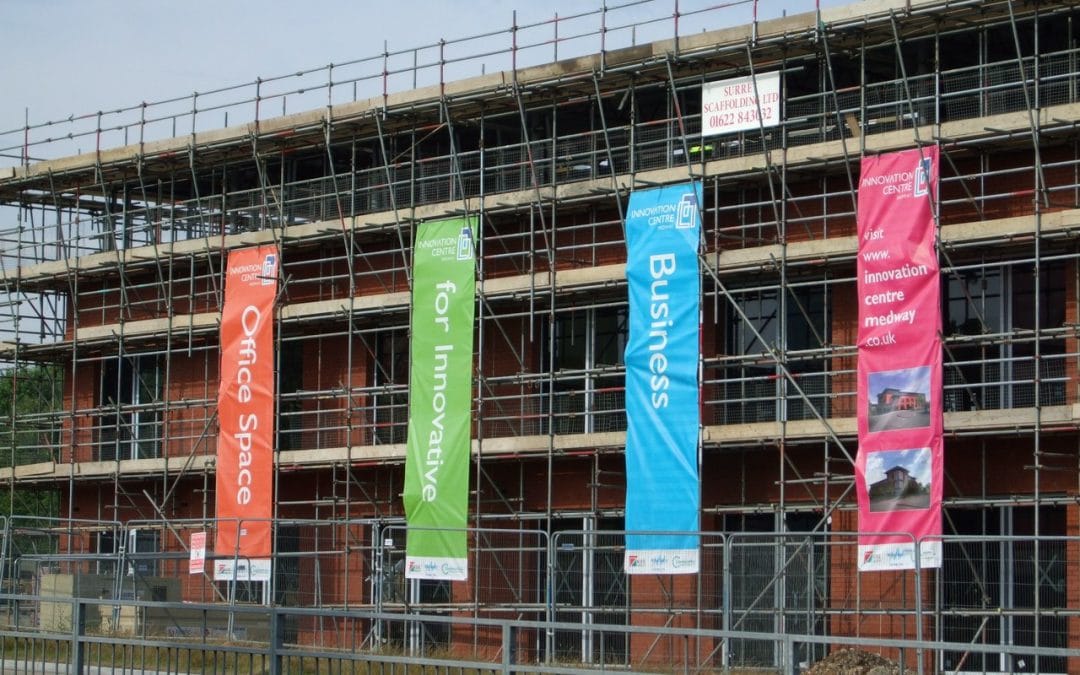 printed-banner-hngin-on-building printed-banner-hngin-on-building