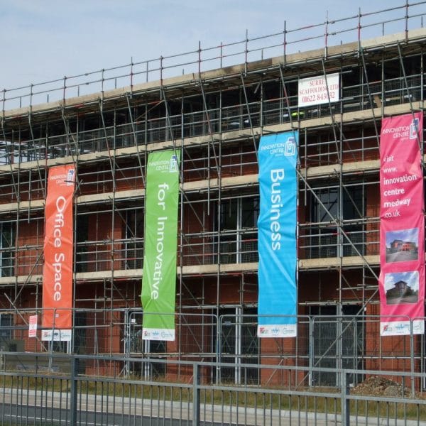 printed-banner-hngin-on-building printed-banner-hngin-on-building